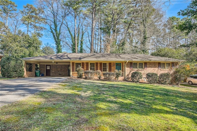 single story home featuring a carport and a front lawn