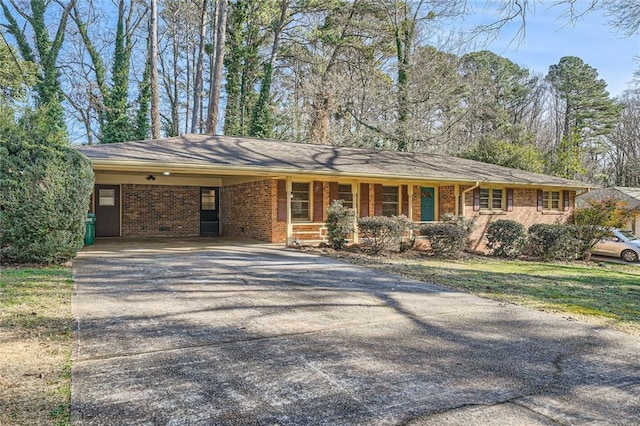 ranch-style home featuring a carport