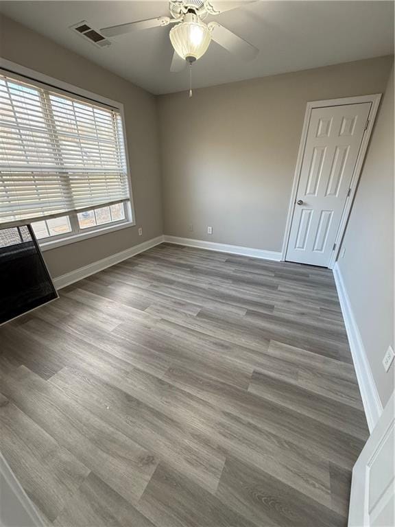 unfurnished room featuring ceiling fan and light hardwood / wood-style floors