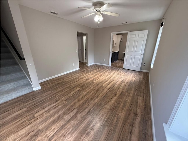 unfurnished bedroom with dark hardwood / wood-style floors and ceiling fan