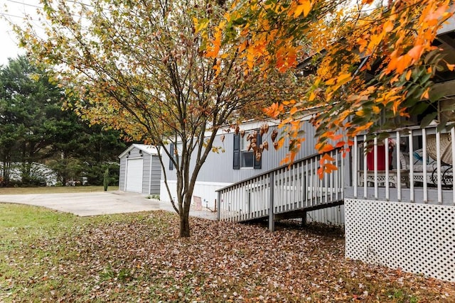 exterior space featuring a patio area and an outbuilding