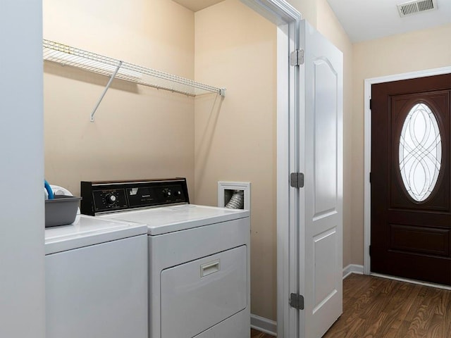 washroom featuring washer and clothes dryer and dark wood-type flooring