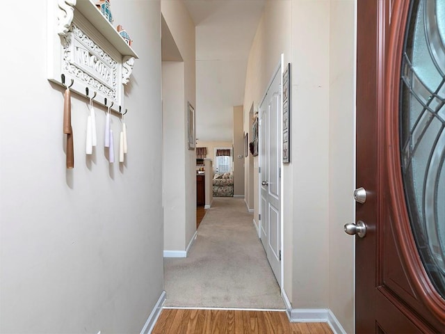 hall with light hardwood / wood-style flooring