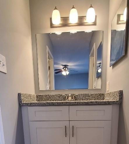 5389 Martins Crossing Rd, Stone Mountain, GA 30088 - bathroom with a ceiling fan and vanity