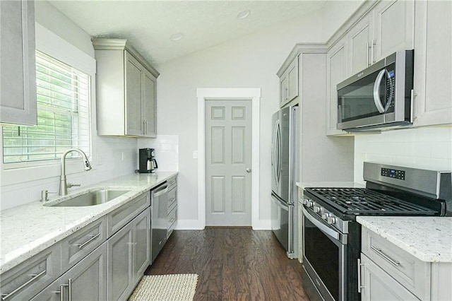 787 Mckendree Lake Way, Lawrenceville, GA 30043 - kitchen featuring stainless steel appliances, vaulted ceiling, dark wood-style floors, tasteful backsplash, and light stone countertops
