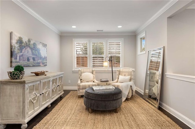 living area featuring dark wood-style floors, crown molding, and baseboards