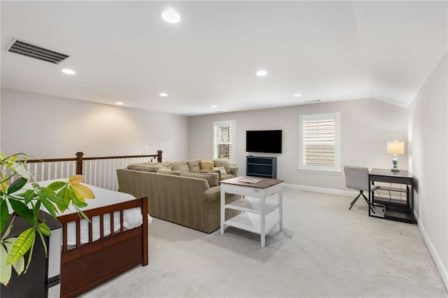 living area with light carpet, baseboards, visible vents, and recessed lighting