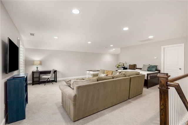 living room featuring baseboards, recessed lighting, visible vents, and light colored carpet