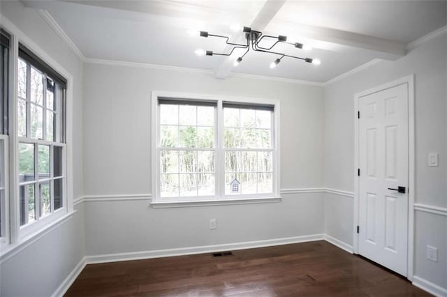 empty room featuring dark wood-type flooring, a notable chandelier, beamed ceiling, and crown molding