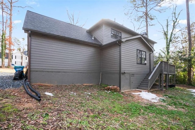 view of side of property with a deck