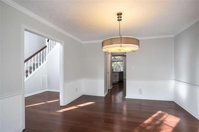 unfurnished room with dark hardwood / wood-style flooring and crown molding