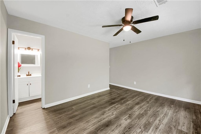 558 Newlin Ct, Lawrenceville, GA 30046 - spare room featuring dark wood-style flooring and a ceiling fan