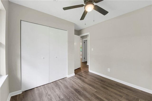 558 Newlin Ct, Lawrenceville, GA 30046 - unfurnished bedroom with wood finished floors, a closet, and ceiling fan
