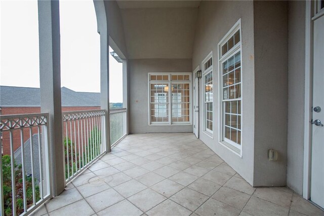 unfurnished sunroom featuring vaulted ceiling