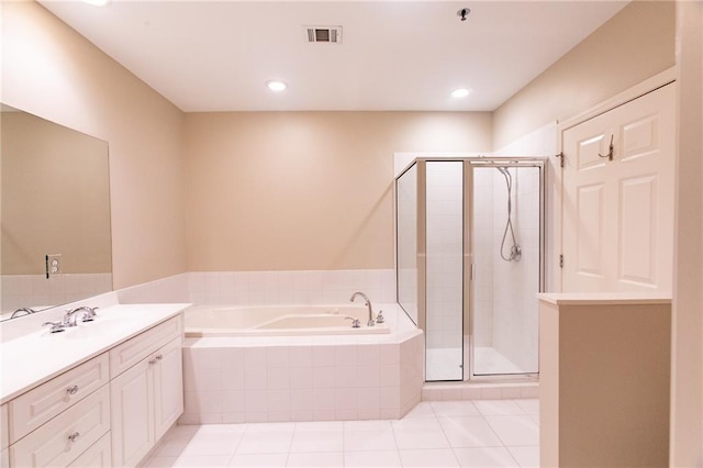 bathroom featuring independent shower and bath, vanity, and tile patterned floors