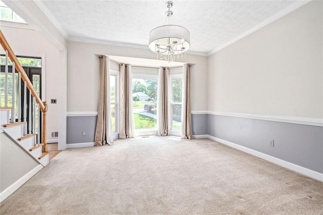 65 Millennial Ct, Lawrenceville, GA 30045 - carpeted entrance foyer featuring a chandelier, healthy amount of natural light, stairway, a textured ceiling, and ornamental molding