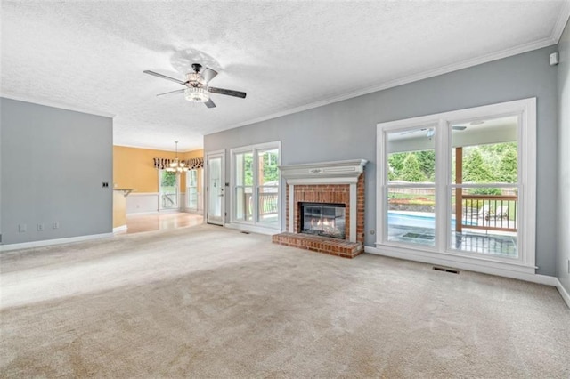 65 Millennial Ct, Lawrenceville, GA 30045 - unfurnished living room with a chandelier, a brick fireplace, a textured ceiling, ceiling fan, and ornamental molding