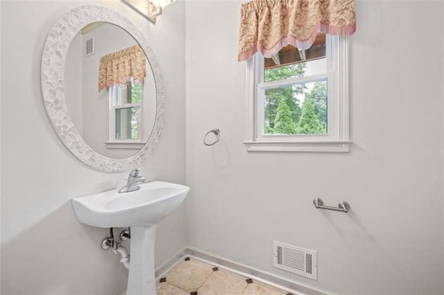 65 Millennial Ct, Lawrenceville, GA 30045 - bathroom with baseboards and tile patterned floors