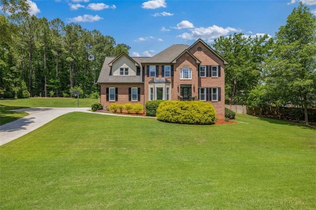 65 Millennial Ct, Lawrenceville, GA 30045 - colonial-style house featuring brick siding