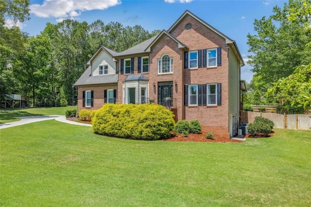 65 Millennial Ct, Lawrenceville, GA 30045 - colonial home featuring brick siding and central air condition unit