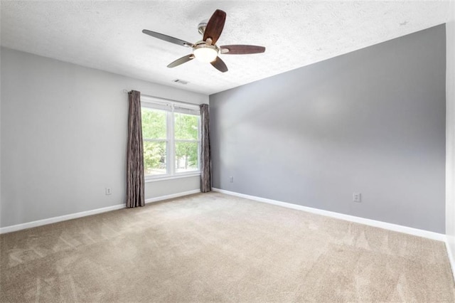 65 Millennial Ct, Lawrenceville, GA 30045 - carpeted empty room with a ceiling fan, baseboards, and a textured ceiling