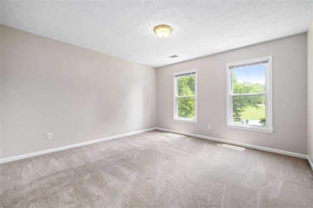 65 Millennial Ct, Lawrenceville, GA 30045 - carpeted spare room with baseboards and a textured ceiling