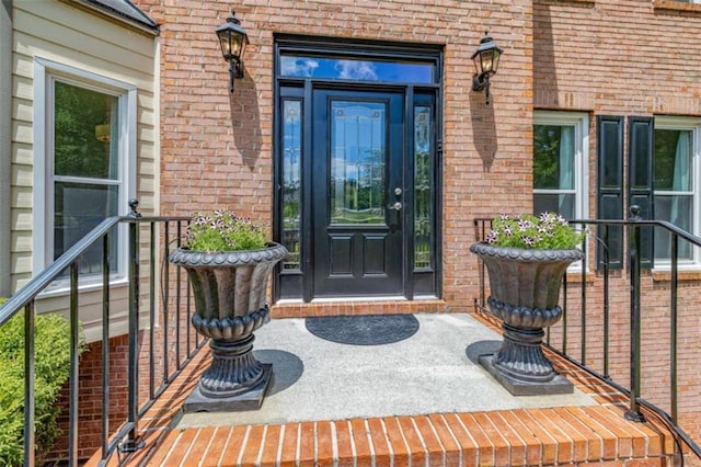 65 Millennial Ct, Lawrenceville, GA 30045 - doorway to property featuring brick siding