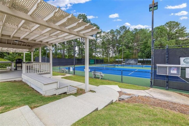 65 Millennial Ct, Lawrenceville, GA 30045 - view of tennis court with fence and a pergola