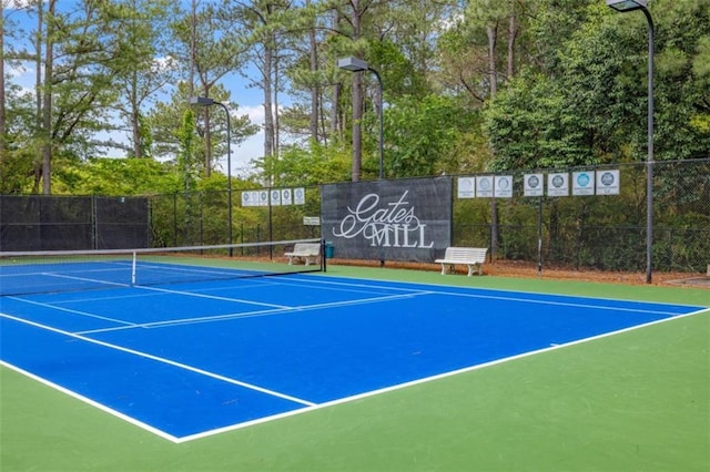 65 Millennial Ct, Lawrenceville, GA 30045 - view of tennis court with fence and community basketball court