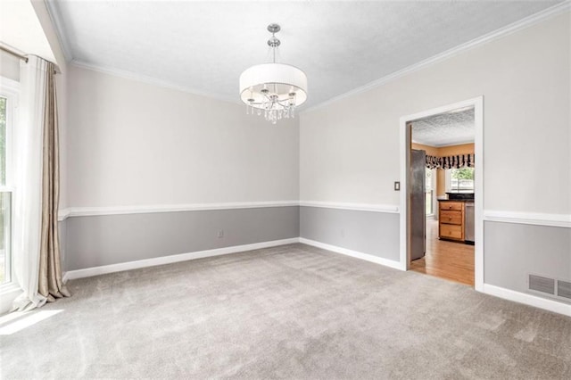 65 Millennial Ct, Lawrenceville, GA 30045 - spare room featuring carpet floors, a chandelier, baseboards, and ornamental molding