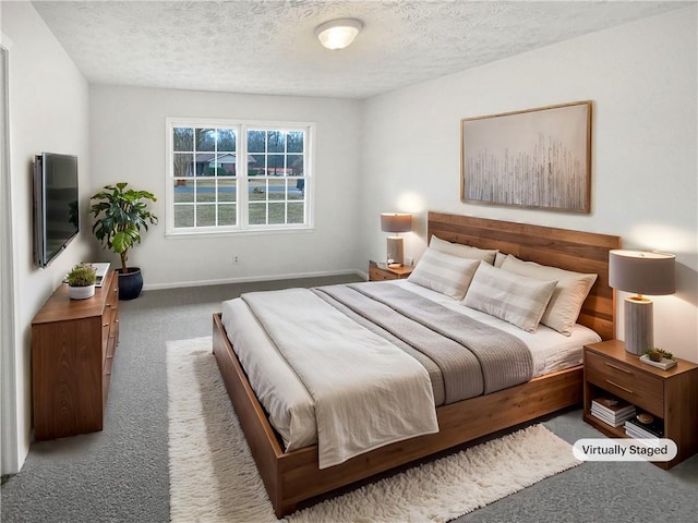 carpeted bedroom with a textured ceiling