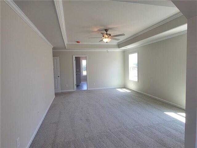 corridor with ornamental molding, carpet flooring, and baseboards