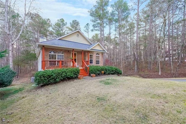 view of front of house featuring a front yard and covered porch