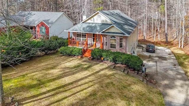 exterior space with covered porch and a front lawn