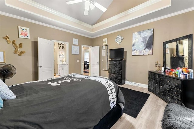 bedroom featuring lofted ceiling, ornamental molding, a raised ceiling, and light hardwood / wood-style flooring