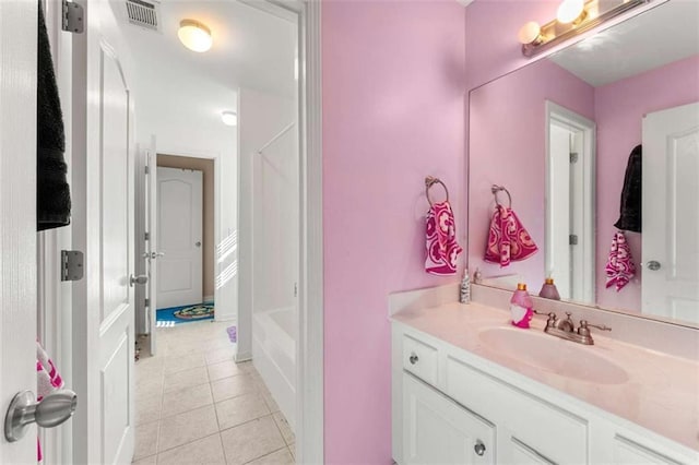 bathroom featuring tile patterned flooring and vanity