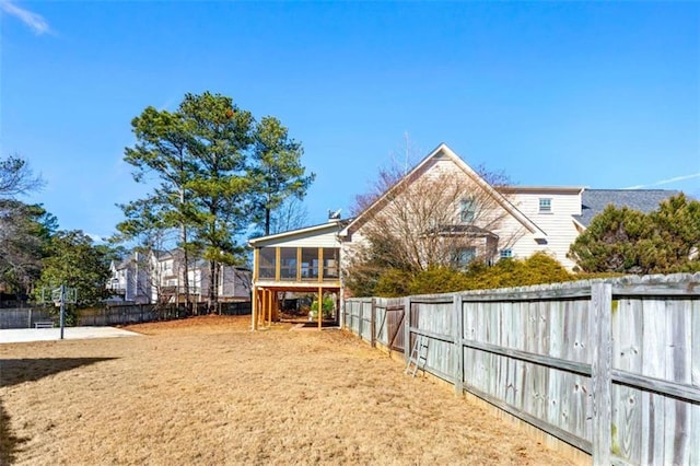 view of yard featuring a sunroom