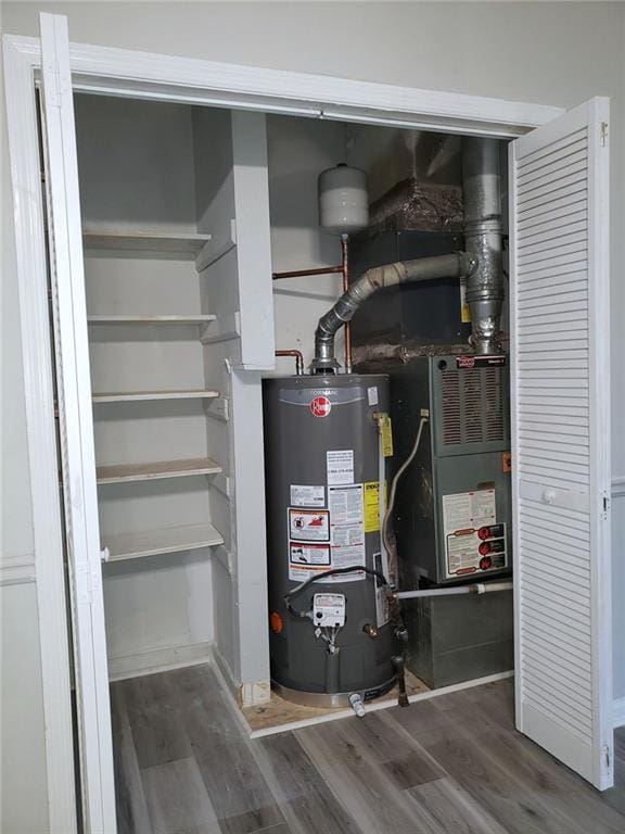 utility room with water heater