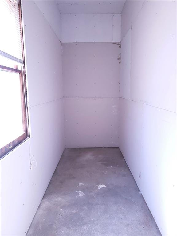 spare room with concrete floors