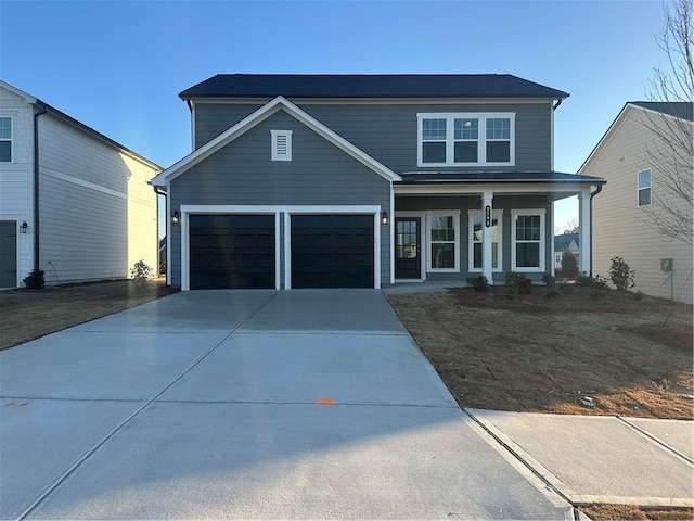 front facade with a garage and a porch