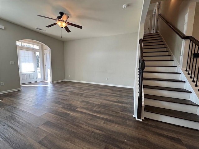 interior space featuring ceiling fan and dark hardwood / wood-style floors