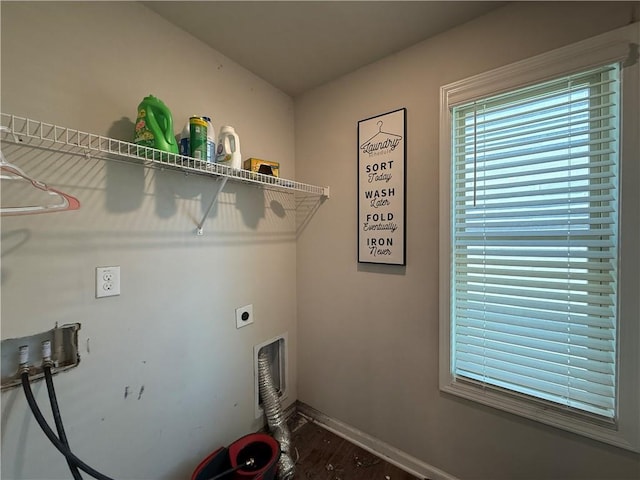 laundry room featuring hookup for a washing machine, hookup for an electric dryer, wood finished floors, laundry area, and baseboards