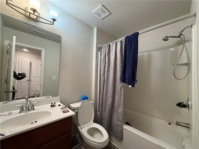 bathroom featuring shower / bath combo, visible vents, vanity, and toilet