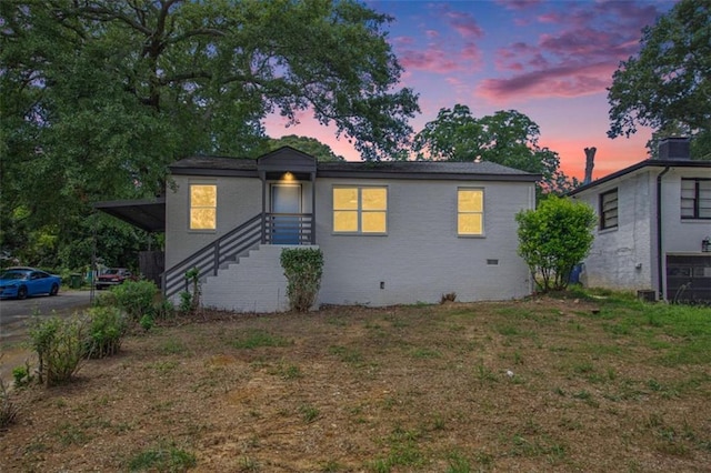 view of front of house with a lawn