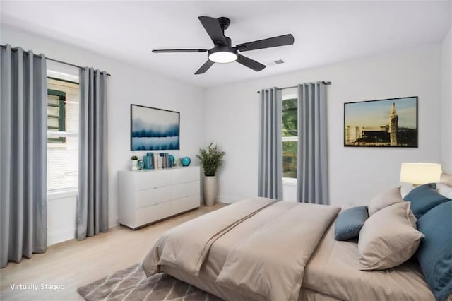 bedroom featuring ceiling fan and light hardwood / wood-style flooring