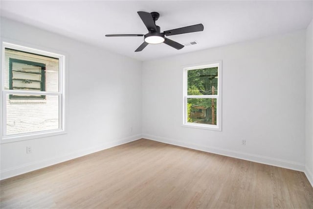 spare room featuring ceiling fan and light hardwood / wood-style floors