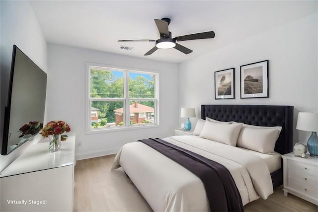 bedroom featuring ceiling fan and light hardwood / wood-style floors