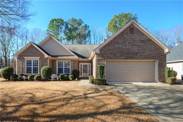 view of front of property with a garage and a front lawn