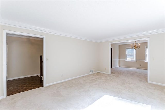 spare room featuring crown molding and carpet