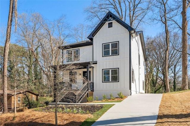 modern inspired farmhouse featuring board and batten siding and concrete driveway